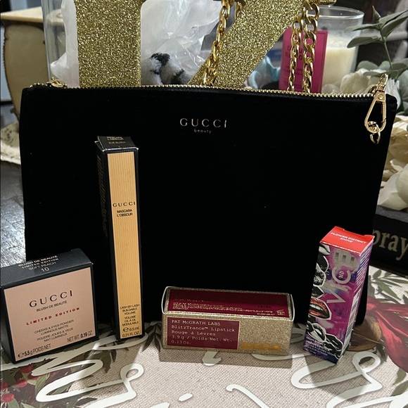 Gucci Handbags - Gucci Black Clutch with Gold Accents